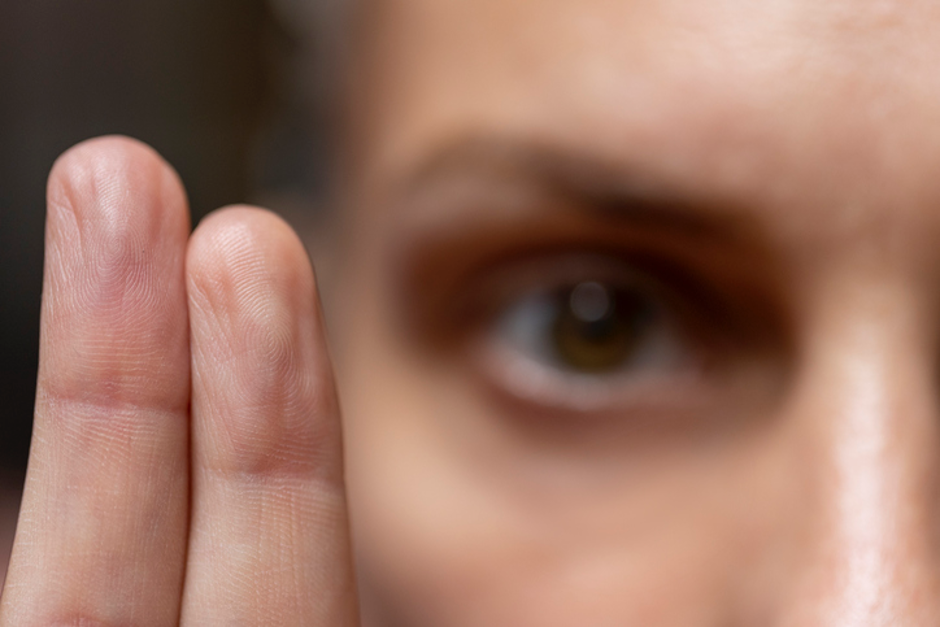Eyes focus on fingers to signify EMDR therapy